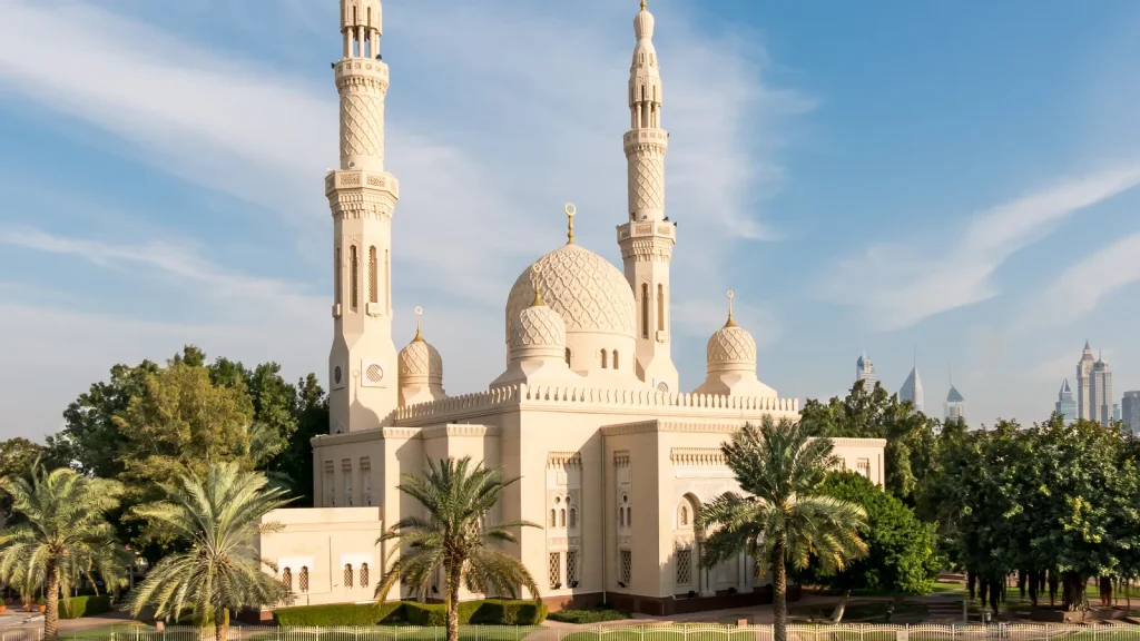 Image Alt Text: "Exterior view of Jumeirah Mosque, an architectural marvel with intricate designs and stunning domes, showcasing its beauty and grandeur in Dubai."