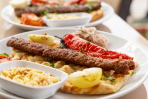 A colorful spread of Turkish dishes including baklava and kebabs, representing the diverse culinary delights of Turkey